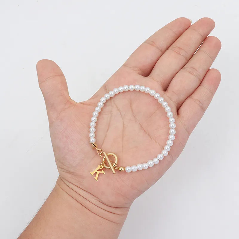 Elegant Simple Style Letter 304 Stainless Steel Artificial Pearl Bracelets In Bulk